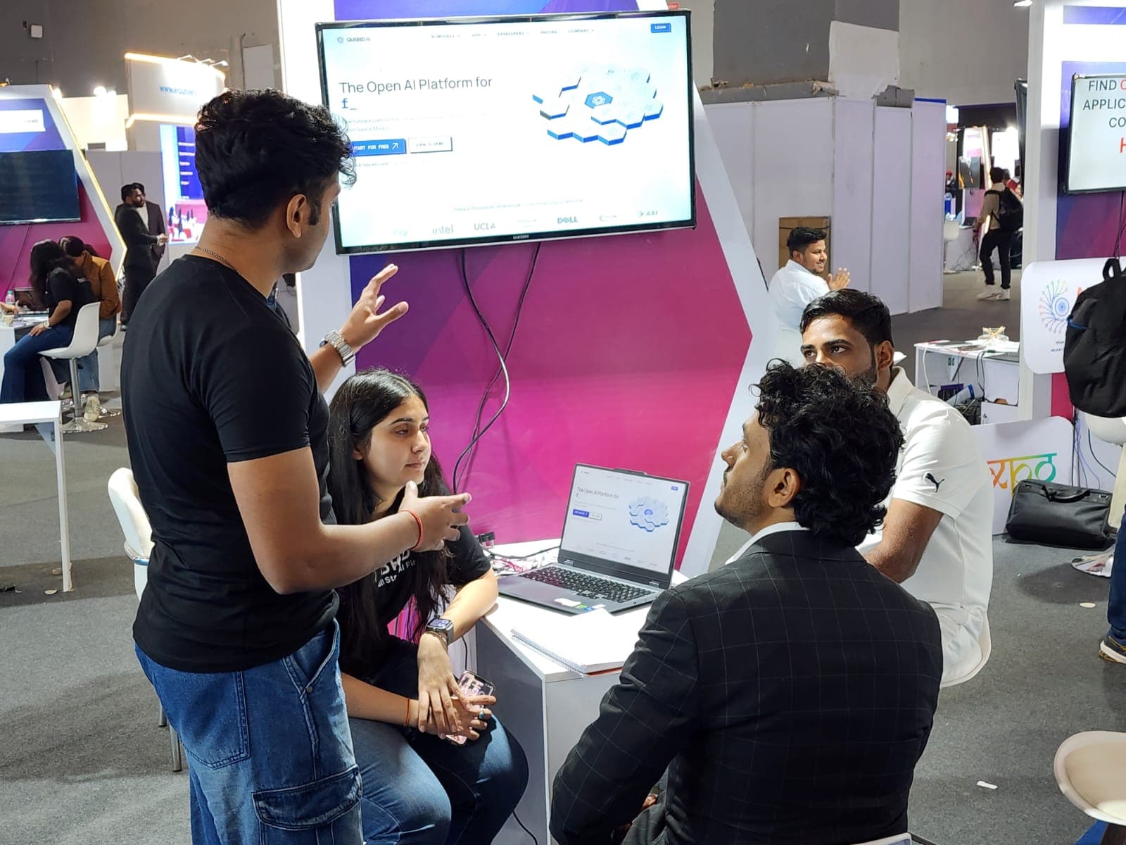 Sharvari speaking with developers at the Qubrid AI booth